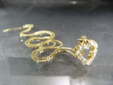 9ct gold chain with 9ct heart shaped pendant set with CZ stones Total weight approx 5.1g