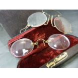 Two pairs of 19th century spectacles in cases. One pair by Curry and Paxton Ltd