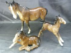 Beswick Bay Thoroughbred Collection No. 915: Mare and two foals (small chip to lying foals mane)