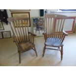 Windsor chairs - A near pair of Elm Windsor carver chairs with slatted backs.