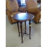 Georgian mahogany wine table on four legs with cross stretcher on pad feet