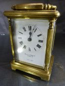 Brass Carriage clock by Mappin and Webb. 5 Glass panelled clock (oval panel to top) is marked to the