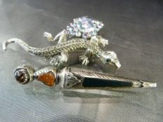 Three various brooches to include a Marcasite set lizard by BJL, Multicoloured set white stone