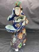 Japanese oriental figure of a lady draped in a Colourful dress holding a fan to her face (unmarked)