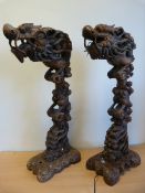 Carved lamps in the form of Chinese Dragons with original switch. The Dragons perched on a stand.