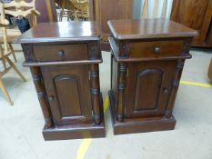 Pair of carved mahogany bedside tables