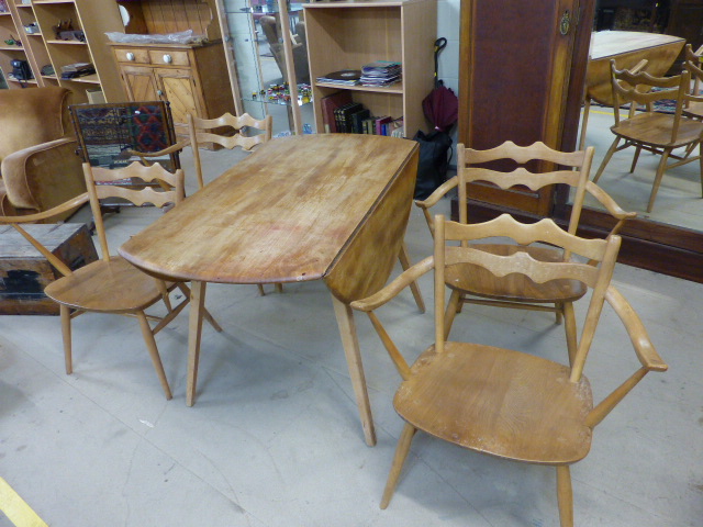 A set of four retro very rare Ercol 493 Windsor Carver Chairs. Only in production for three years