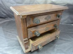 Apprentice oak early chest of three drawers. Each drawer carved with metal knobs and locks. Raised