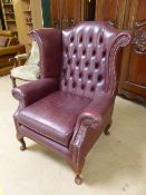 Wingback Chair - in the Queen Anne design having a curved button back and beaded work to front.