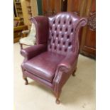 Wingback Chair - in the Queen Anne design having a curved button back and beaded work to front.