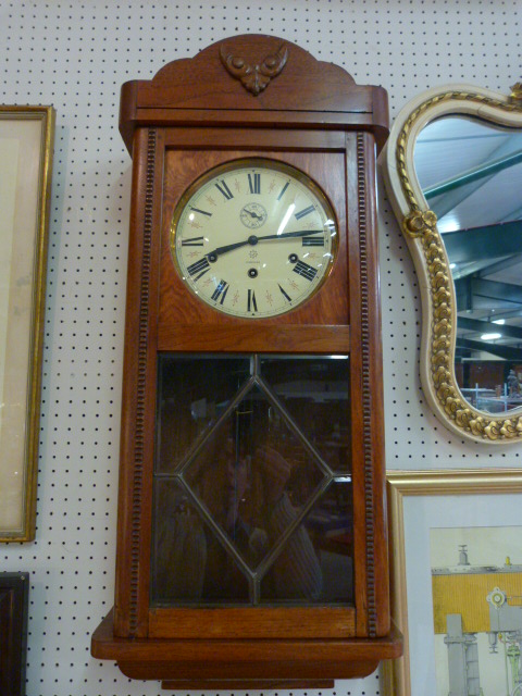 German 8 day wall clock with Westminster chimes, oak case and Junghans movement (pendulum & Key in