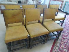 Set of seven oak dining room chairs with fabric upholstery. Legs with turned double stretchers