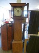 Oak longcase clock with painted Dial having the Date Aperture. Floral motifs to corners with painted