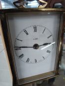 Metamec brass cased carriage clock with plaque to inside 'Bravingtons London'