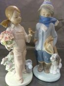 Two Lladro figures - 1 of a boy wrapped in a scarf with his puppy and the other of a girl in the