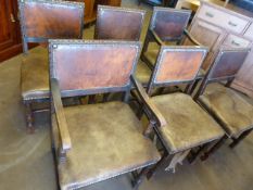 Set of six chairs in the Arts and Crafts style with leather pad seat and back. Carved Corinthian