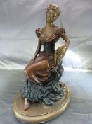 An Austin Sculpture spelter figure of a lady dated 1992.