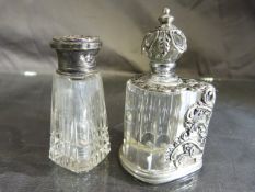 Silver topped cut glass scent bottle and an unmarked thai version