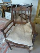 American oak carver chair in the Arts and Crafts Style. The Back with turned wooden spindle back