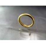 22ct Gold Wedding band Approx Weight - 7.1g. Unusual box marked 'To the Royal Family' with the crown