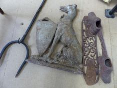 Cast iron doorstop in the form of a Tall grey hound seated with a paw upon a shield along with a