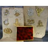 Selection of 10 cap badges and a cigarette case