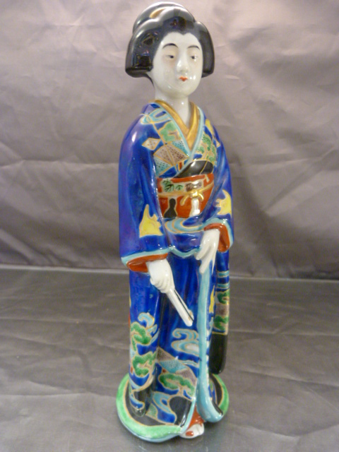 Oriental figure of a lady with blue ground decoration.