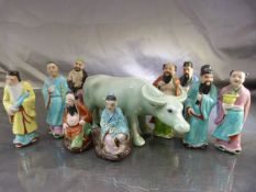 Celadon Water Buffalo and a collection of oriental figures (2 A/F)