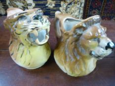 Two Antique jugs/Pitchers in porcelain depicting a Lions head and a Tigers head. Both unmarked but