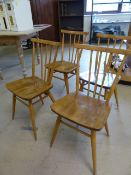 Set of four blonde Ercol stickback chairs of simple design