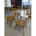 Set of four blonde Ercol stickback chairs of simple design