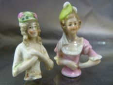 Two Tea Cosy embellishments of ladies with hats (Porcelain c.1920's)