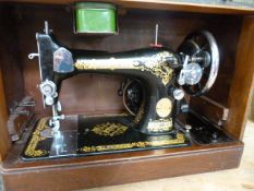 Singer Sewing machine in fitted case converted for electric use. Complete with all accessories and