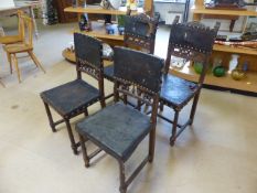 Set of four gothic style dining chair with leather back and seats. Leather pressed in the design