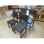 Set of four gothic style dining chair with leather back and seats. Leather pressed in the design