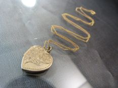 Gold 9ct heart shaped locket on 9ct Gold fine chain (total weight approx 5.6g)