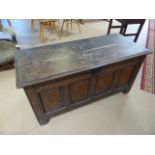 Antique oak coffer on block feet with two planked top