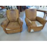 Pair of French Tan leather club chairs. Both in need of re-upholstery.