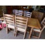 Modern oak country style table with stretchers and 6 chairs. Good Condition