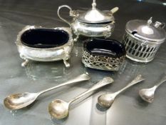 Four silver hallmarked salts and one EPNS with various spoons (silver & EPNS) all with blue glass