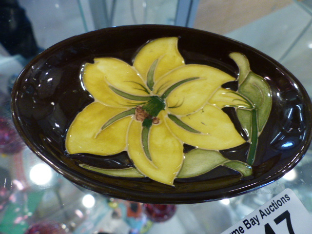 Moorcroft small pin dish of oval form - impressed marks to base with tube line decoration