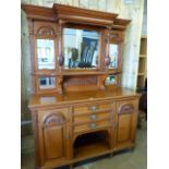 Satinwood dresser with central cupboards and recess below flanked by two Cupboards in the Art Deco