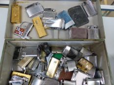 Large collection of approx 40 lighter to include Ronson, others and a Corona Gun lighter