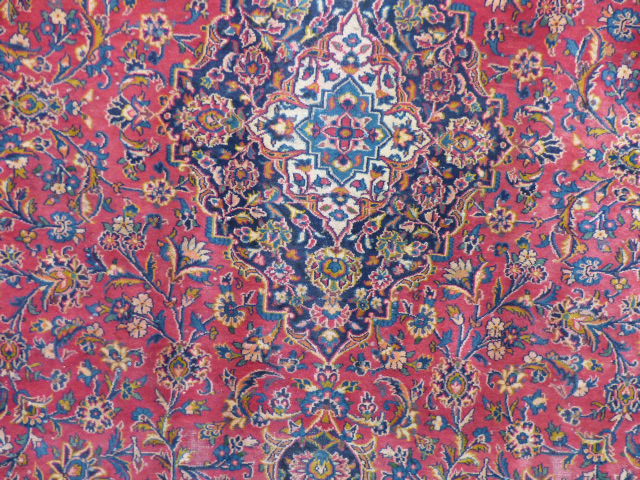 Large red ground carpet with all over design - Image 2 of 2