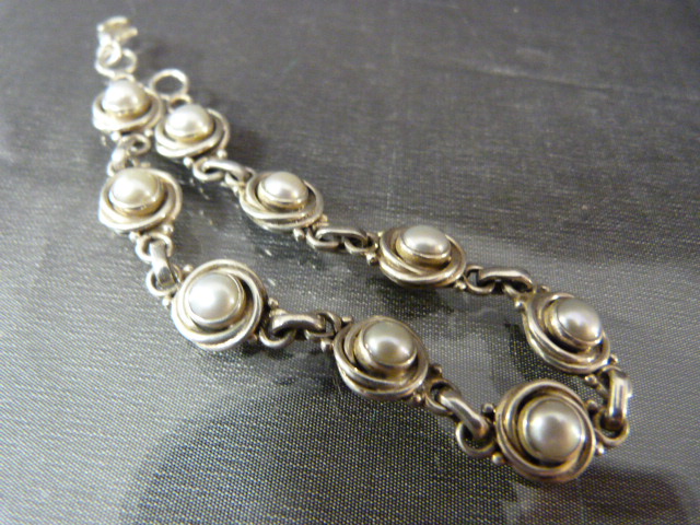 Hallmarked silver bracelet set with interspersed pearls in a circular design. - Image 2 of 4