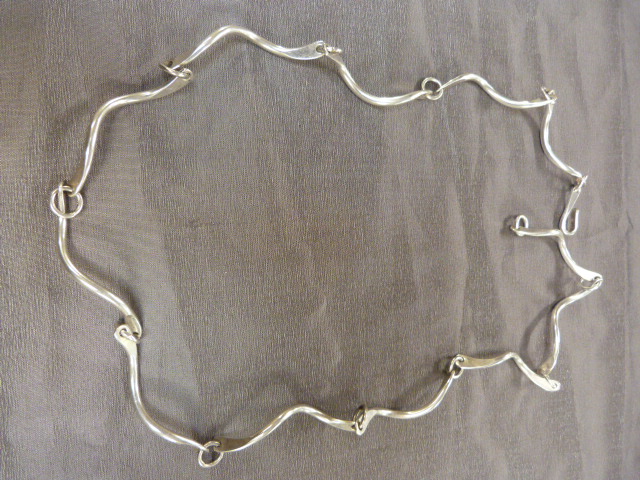 CONTEMPORARY ‘Sterling’ Necklace by PJ. The approx: 28” long necklace is made up of 12 approx: 3.