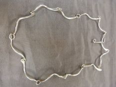 CONTEMPORARY ‘Sterling’ Necklace by PJ. The approx: 28” long necklace is made up of 12 approx: 3.