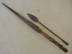 Tribal Spear head poss African and a carved wooden souvenir spear.