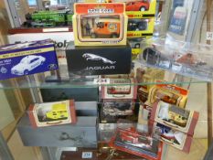 Collection of boxed Die-cast cars to include Eddie Stobart, Days Gone, Jaguar, Great British buses