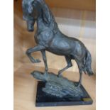 Bronzed figure of a horse stood on Rock with signature to rock Casasola. Mounted on marble plinth